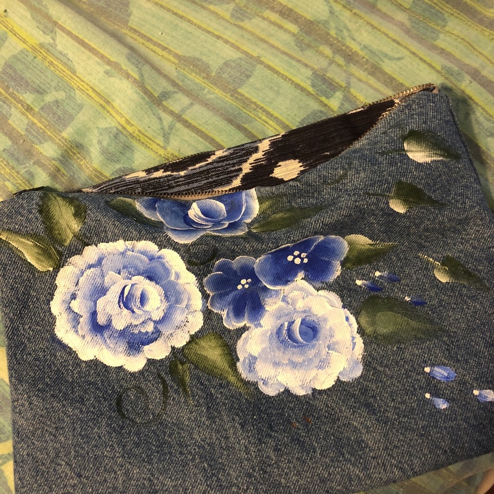 Hand painted Roses on denim clutch bag.